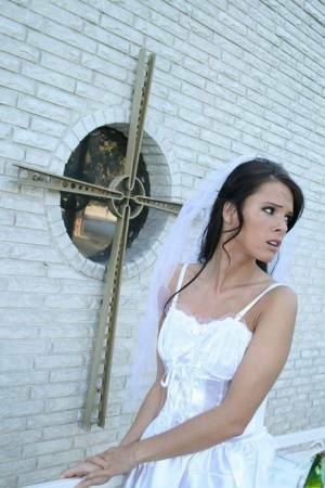 MILF babe in bride's dress Jennifer Dark spreading pussy on picsfans.net